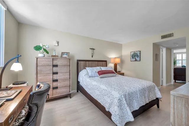 a bedroom with a bed and a dresser