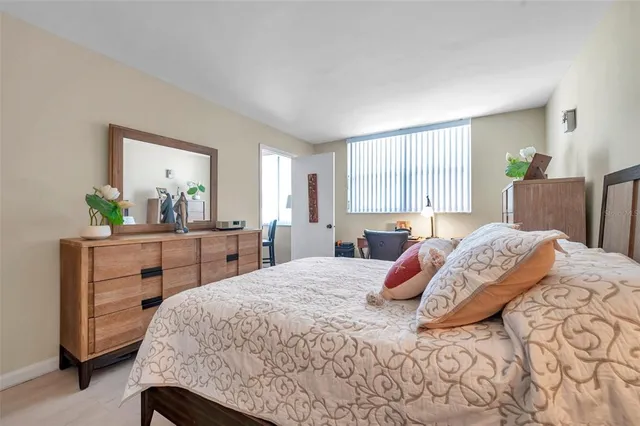 a bed room with a bed and a lamp