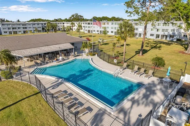 a aerial view of a house with a swimming pool