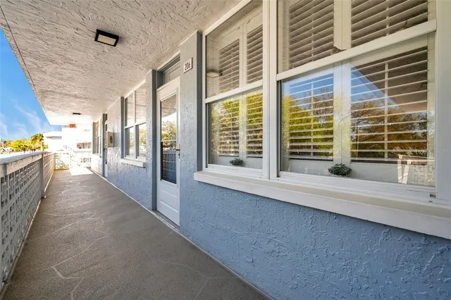 a living room with furniture a fireplace and a window