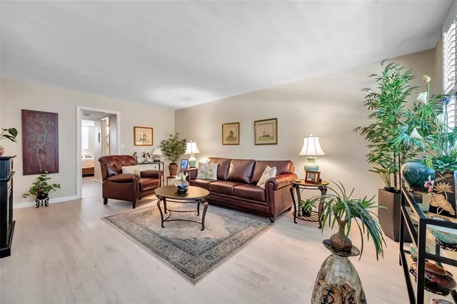 a view of a dining room with furniture and a chandelier