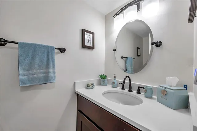 a en suite bathroom with a sink double vanity and a mirror
