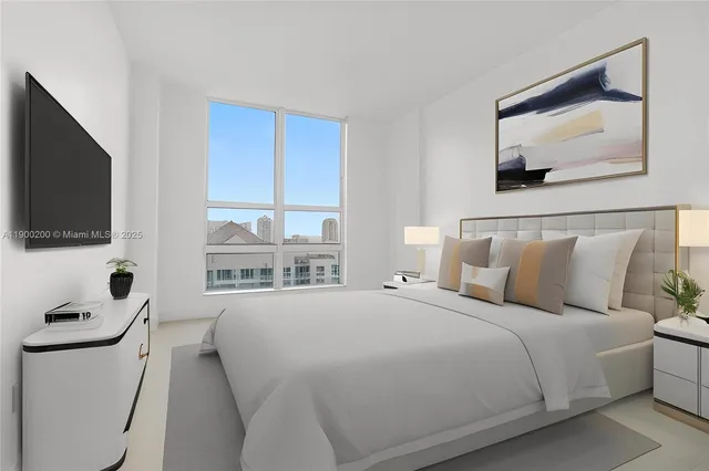 an empty room with windows and chandelier