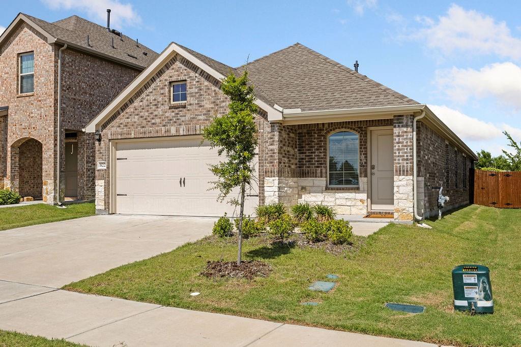 822 Ramble Road Lavon, TX 75166 - Photo 3 of 35 Brick and stone exterior featuring an attached two-car garage