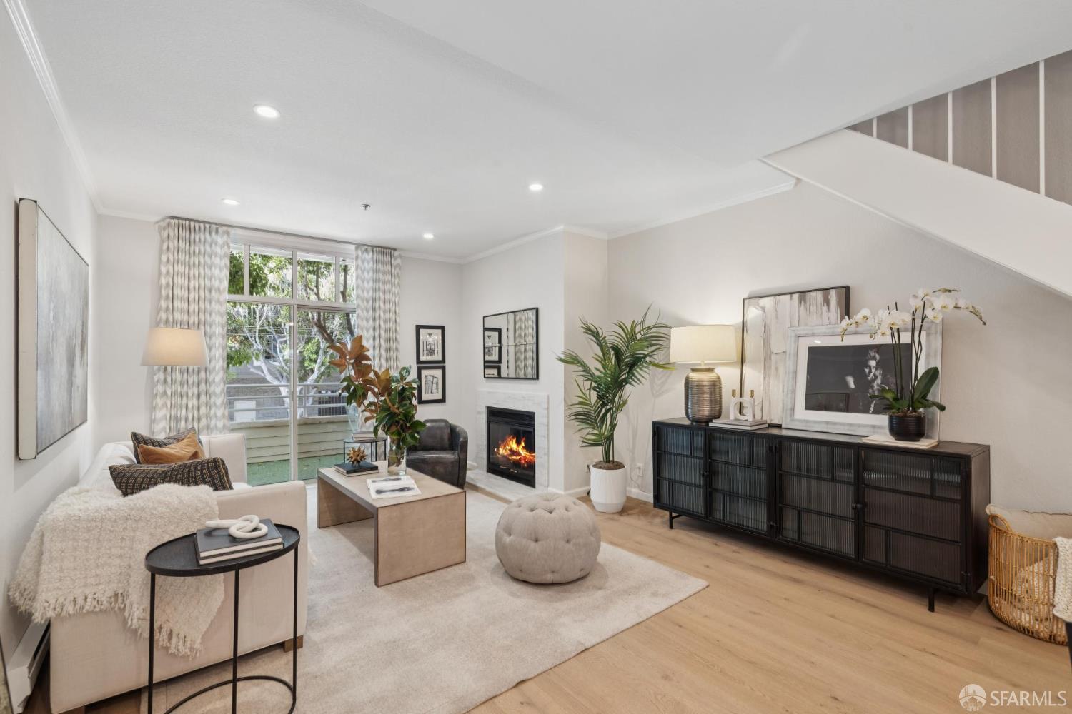 2075 Sutter Street, Unit 215 San Francisco, CA 94115 - Photo 1 of 14 a living room with furniture and a fireplace