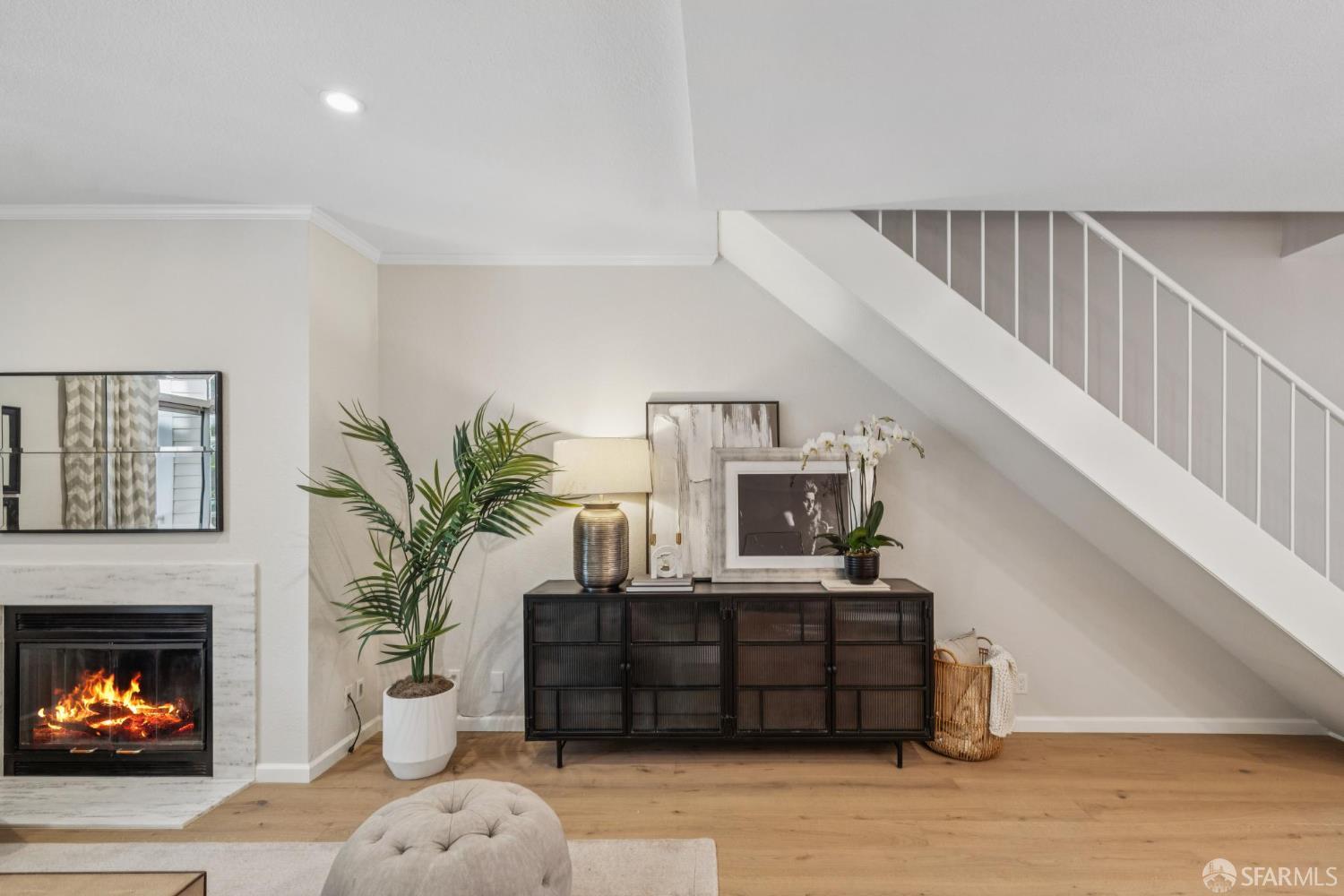 2075 Sutter Street, Unit 215 San Francisco, CA 94115 - Photo 2 of 14 a living room with furniture and a fireplace