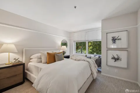 a bedroom with double bed and a window