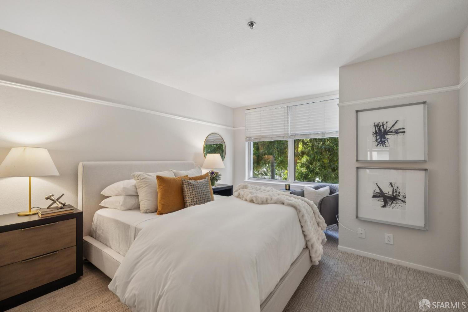 2075 Sutter Street, Unit 215 San Francisco, CA 94115 - Photo 9 of 14 a bedroom with double bed and a window