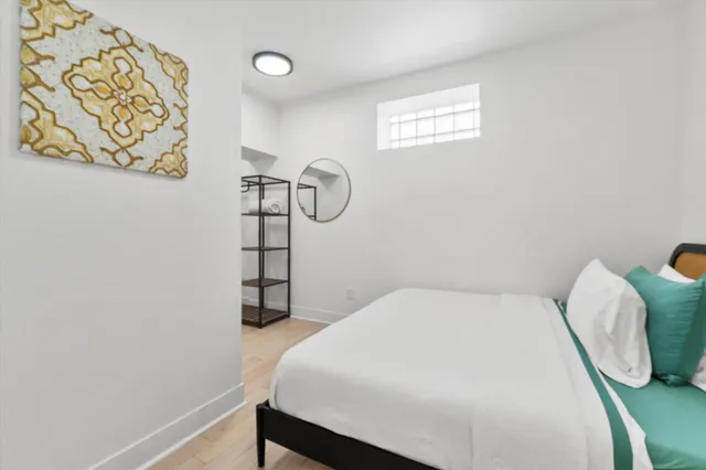 a bedroom with a bed and a chair