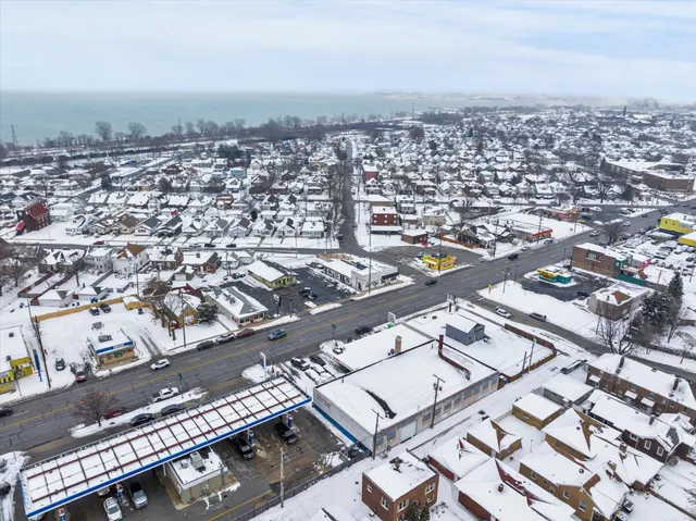 an aerial view of a city with ocean view