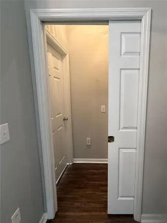 a view of a bathroom with wooden floor