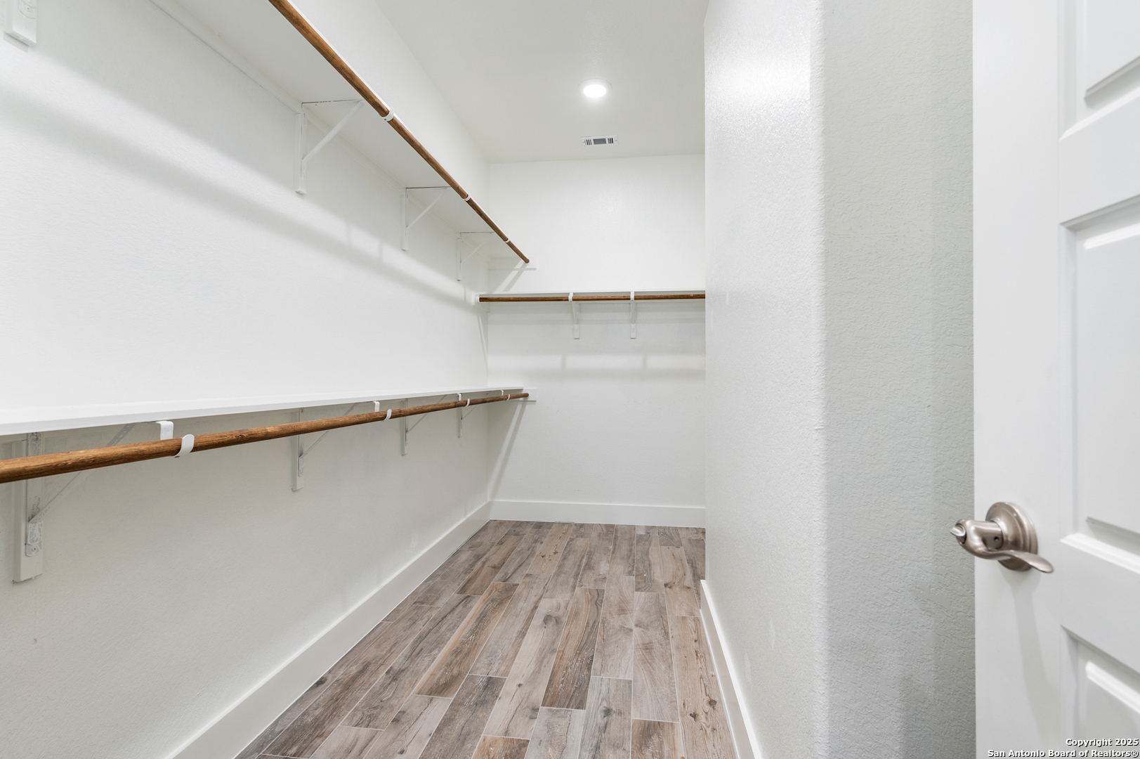 141 Prairie Tea Spring Branch, TX 78070 - Photo 15 of 26 a view of a room with wooden floor and staircase