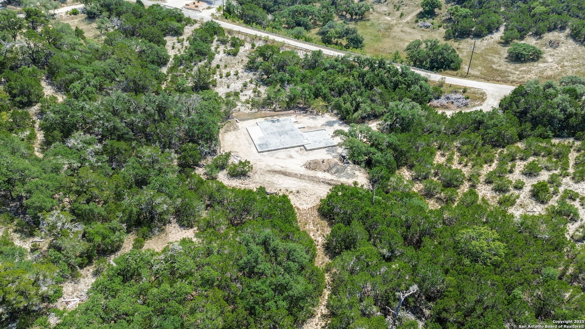 141 Prairie Tea Spring Branch, TX 78070 - Photo 2 of 26 an aerial view of residential house with outdoor space and trees all around