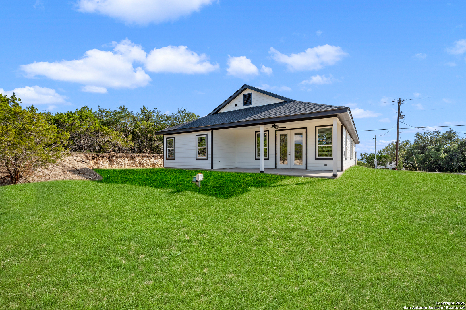 141 Prairie Tea Spring Branch, TX 78070 - Photo 23 of 26 a front view of a house with a yard