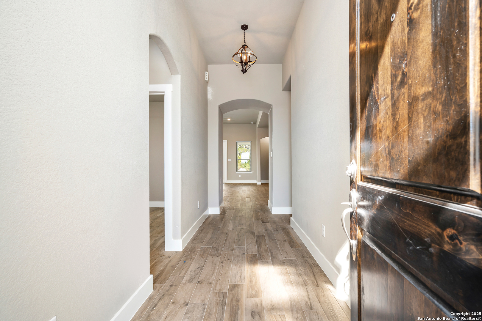 141 Prairie Tea Spring Branch, TX 78070 - Photo 5 of 26 a view of a hallway with wooden floor