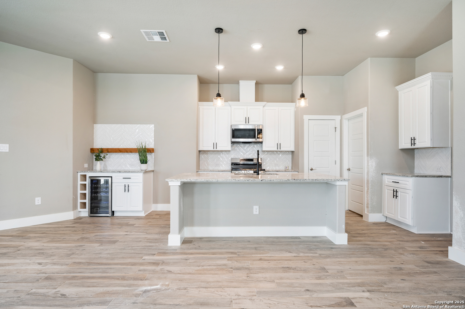 141 Prairie Tea Spring Branch, TX 78070 - Photo 8 of 26 a view of kitchen with wooden floor and stainless steel appliances