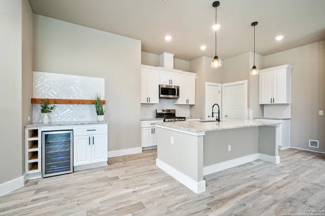 a large kitchen with cabinets