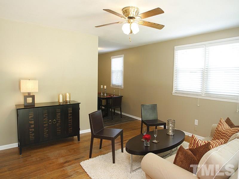3428 Apache Drive Raleigh, NC 27609 - Photo 3 of 15 a living room with furniture and wooden floor