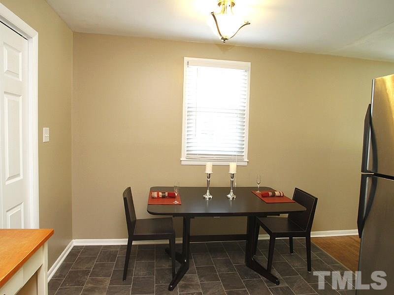 3428 Apache Drive Raleigh, NC 27609 - Photo 5 of 15 a view of a dining room with a table and chairs