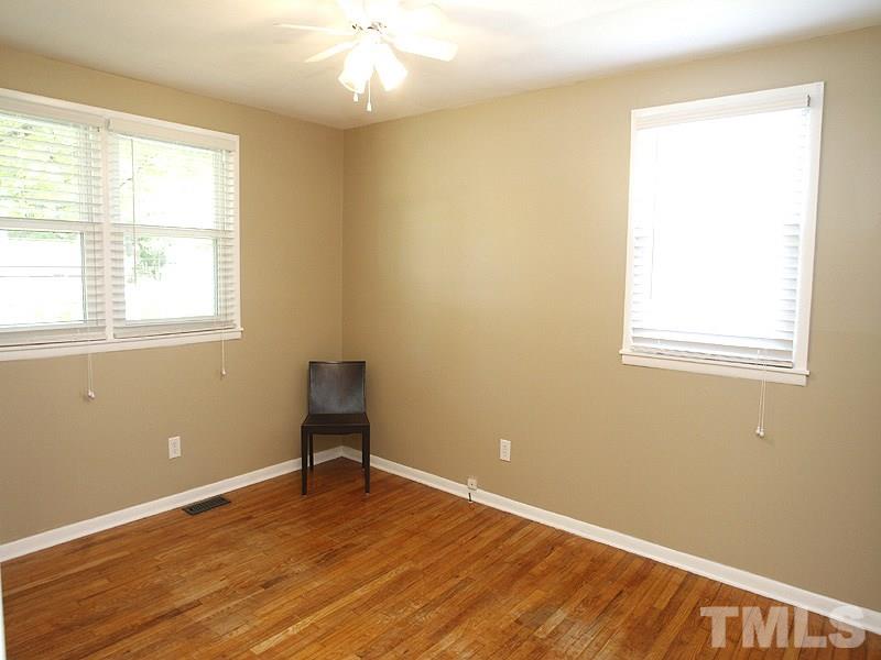 3428 Apache Drive Raleigh, NC 27609 - Photo 9 of 15 a room with a window and wooden floor