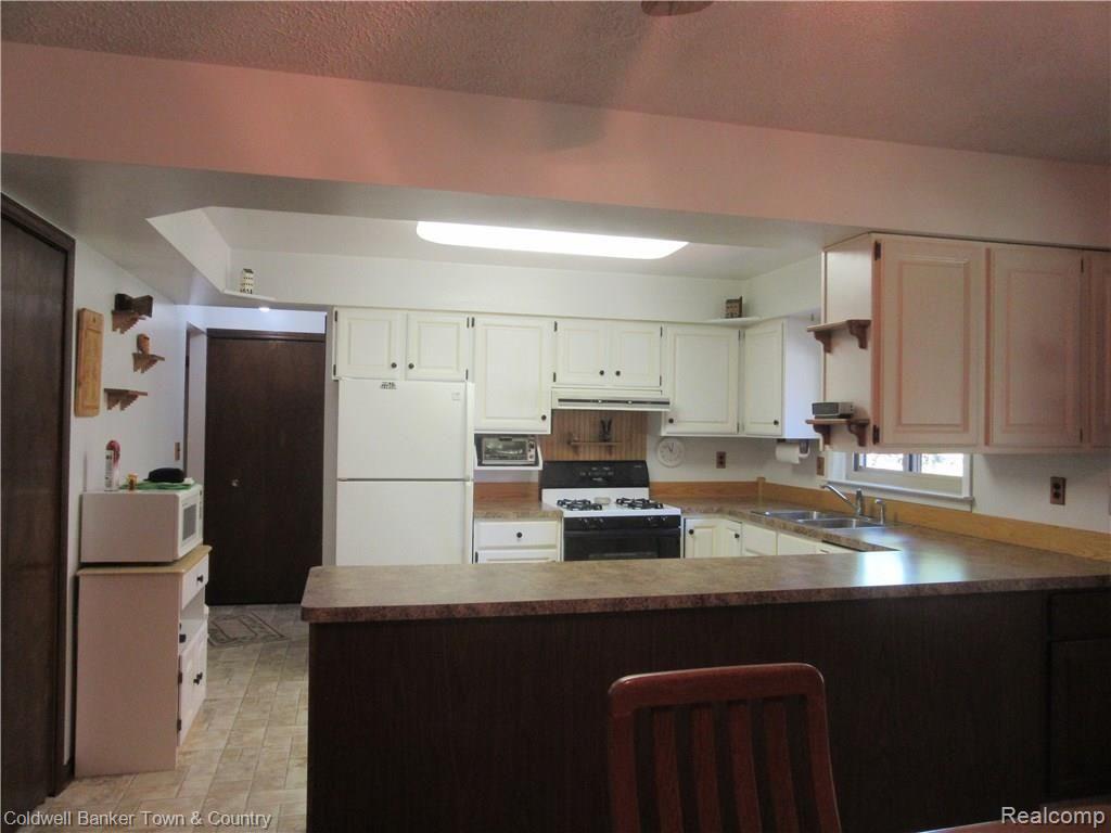 3758 Beattie Road Howell, MI 48843 - Photo 12 of 62 view from dining room to kitchen