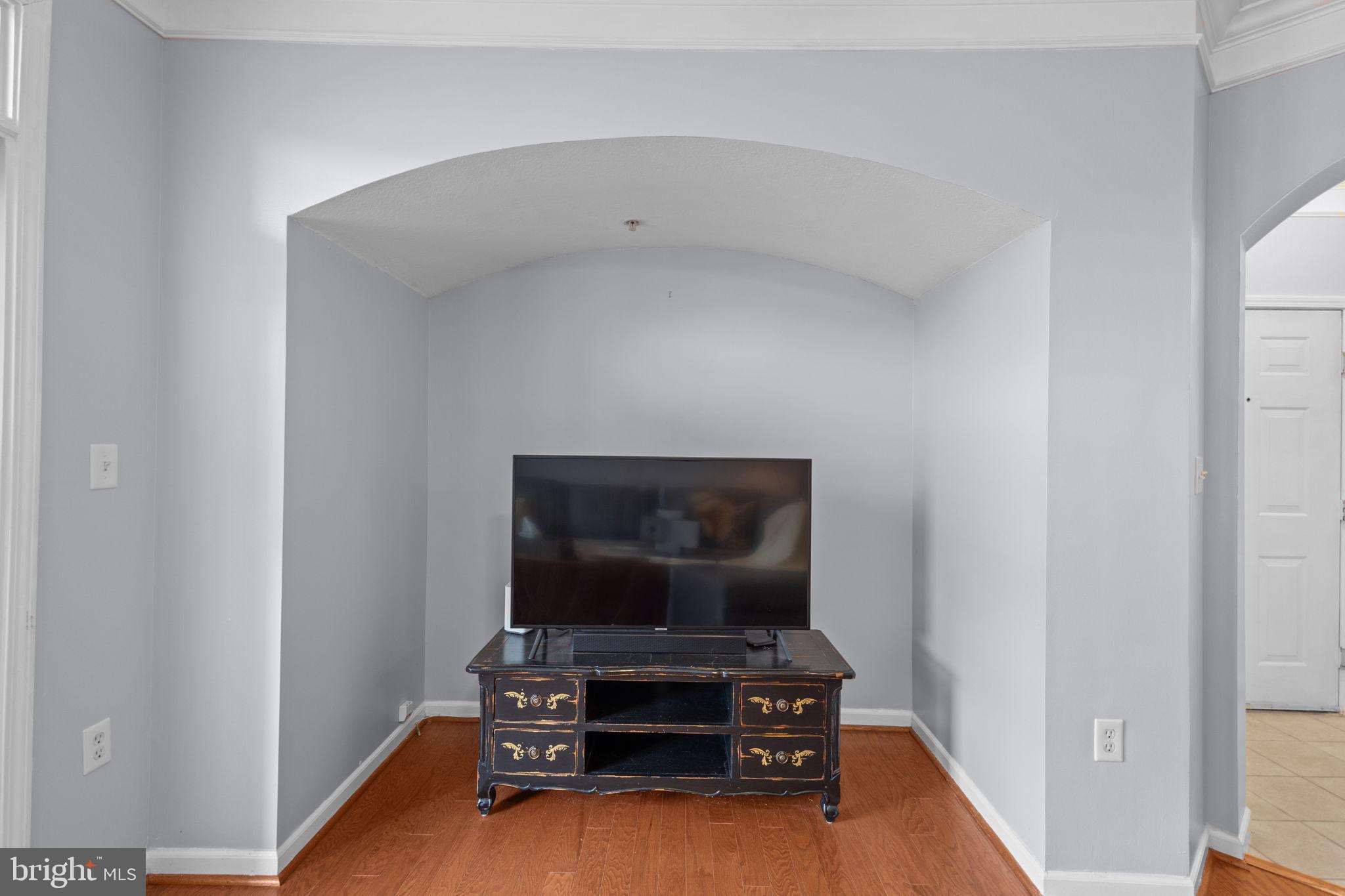 508 Sunset View Terrace Southeast, Unit 302 Leesburg, VA 20175 - Photo 11 of 30 a living room with furniture and a flat screen tv