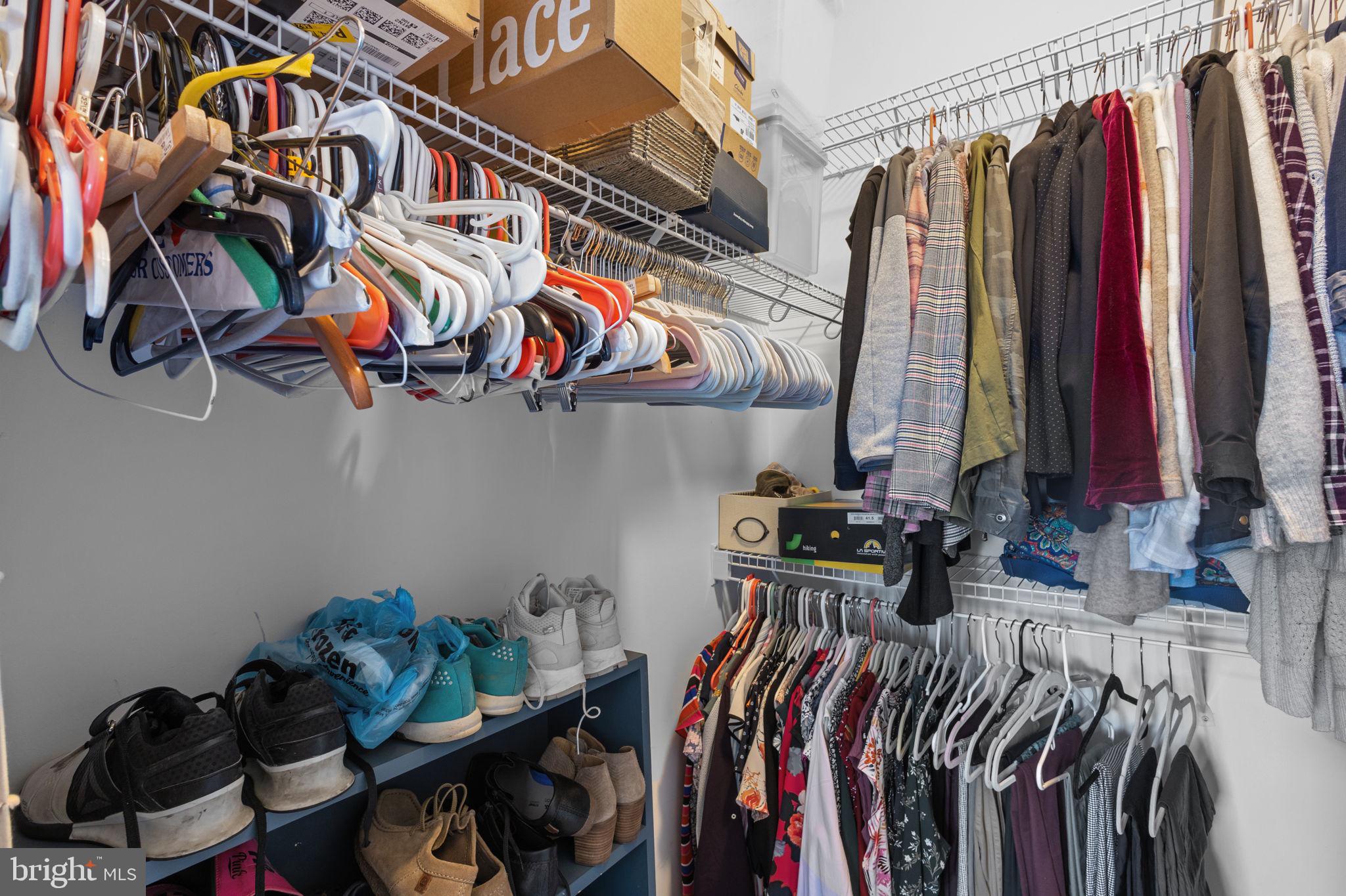 508 Sunset View Terrace Southeast, Unit 302 Leesburg, VA 20175 - Photo 16 of 30 a view of walk in closet with clothes and shoes