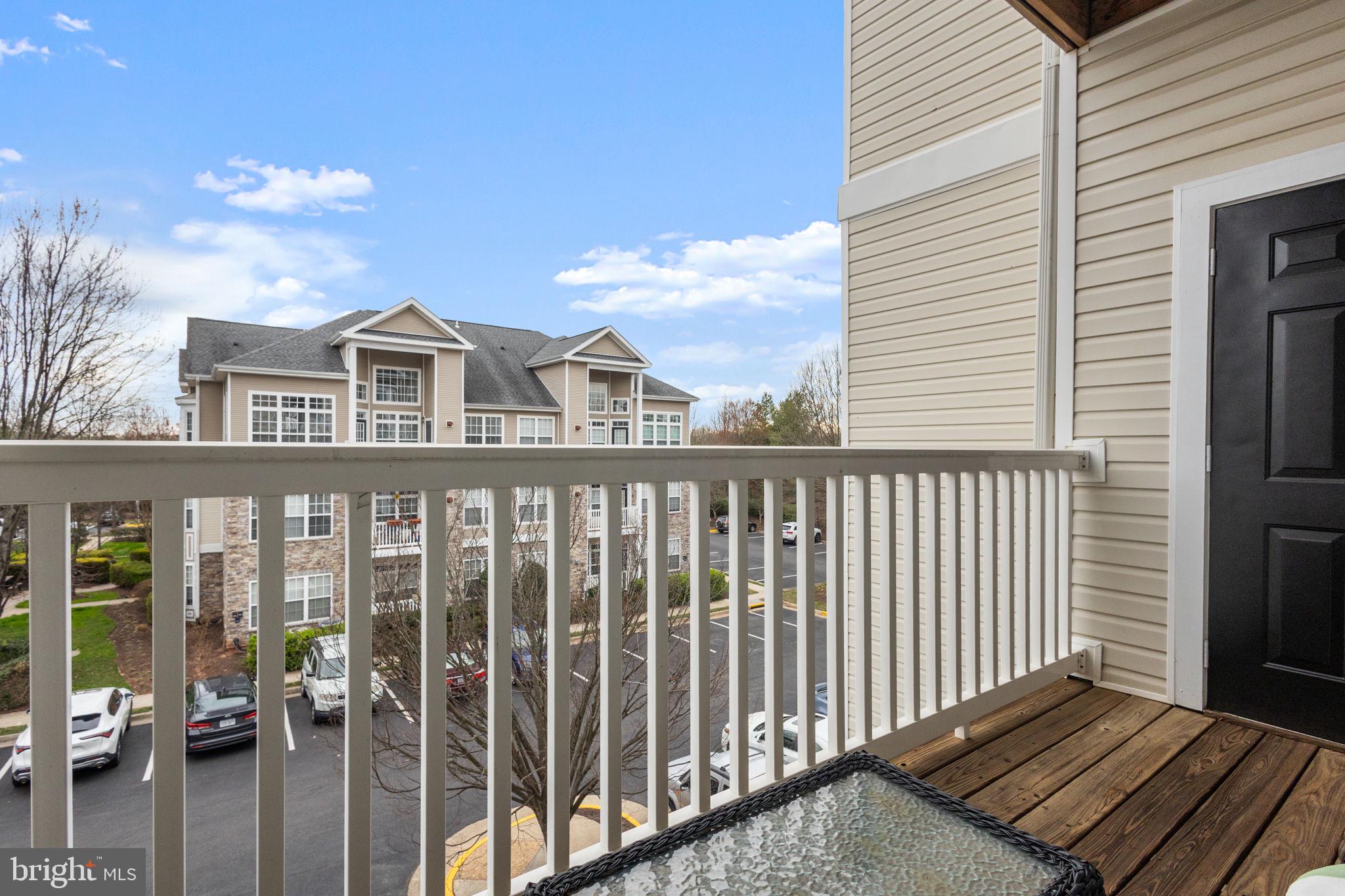 508 Sunset View Terrace Southeast, Unit 302 Leesburg, VA 20175 - Photo 18 of 30 a view of a city from a balcony