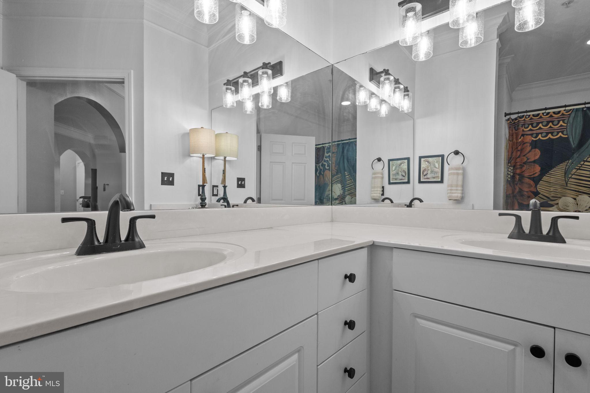508 Sunset View Terrace Southeast, Unit 302 Leesburg, VA 20175 - Photo 20 of 30 a bathroom with a sink a vanity and a mirror