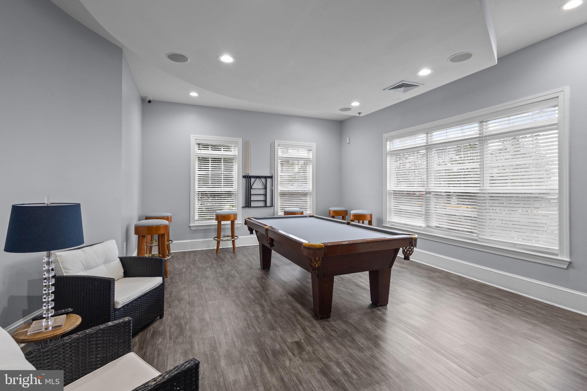 508 Sunset View Terrace Southeast, Unit 302 Leesburg, VA 20175 - Photo 24 of 30 a room with furniture pool table table and a window