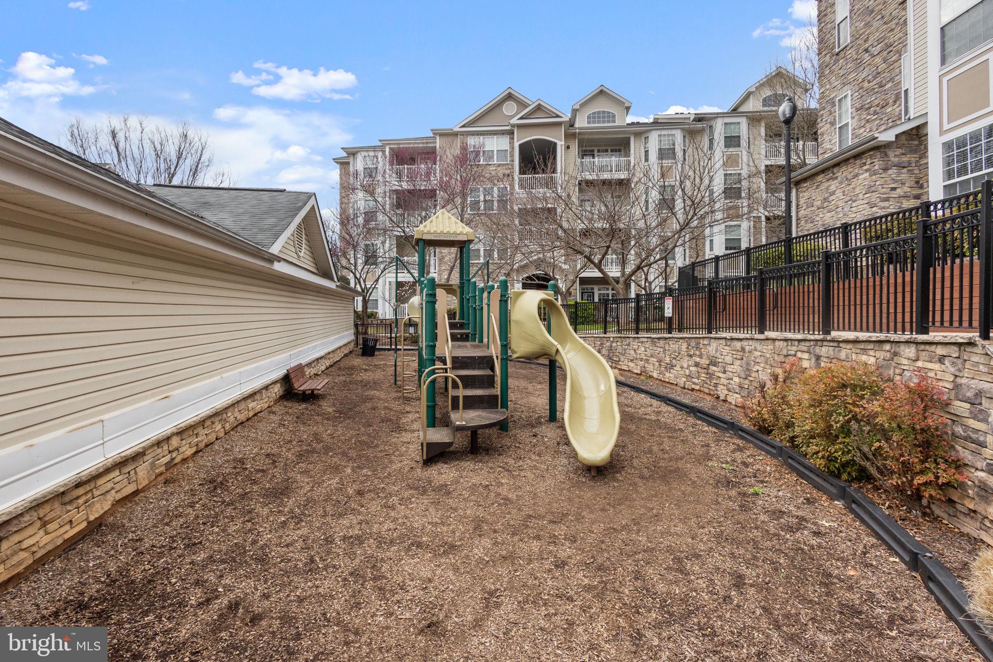 508 Sunset View Terrace Southeast, Unit 302 Leesburg, VA 20175 - Photo 27 of 30 a view of a house with a park