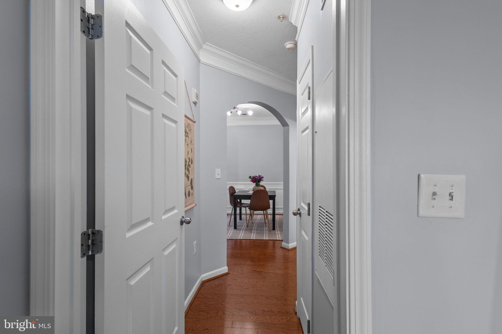 508 Sunset View Terrace Southeast, Unit 302 Leesburg, VA 20175 - Photo 3 of 30 a view of a hallway with living room and furniture