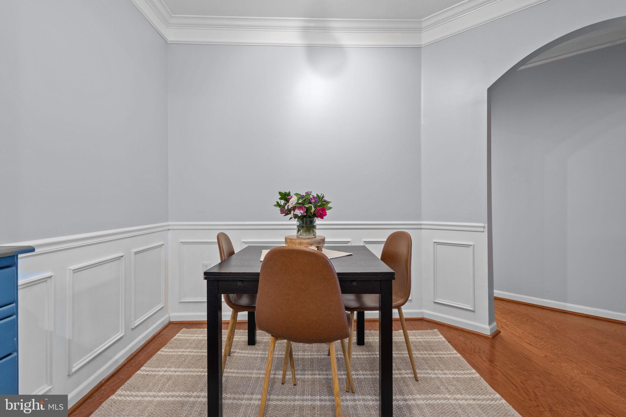 508 Sunset View Terrace Southeast, Unit 302 Leesburg, VA 20175 - Photo 4 of 30 a view of a dining room with furniture and wooden floor