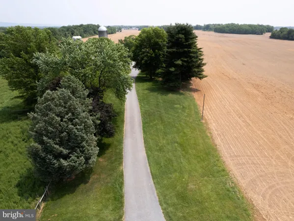 a bedroom with a large bed and a large window