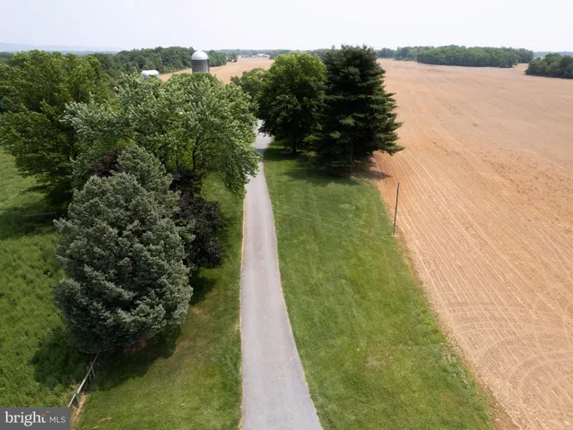 a bedroom with a large bed and a large window