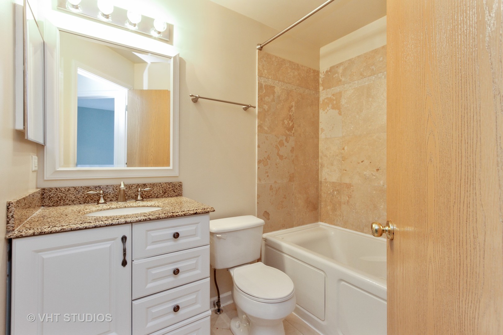 34379 North Barberry Road Round Lake, IL 60073 - Photo 9 of 10 a bathroom with a granite countertop sink toilet mirror vanity and bathtub