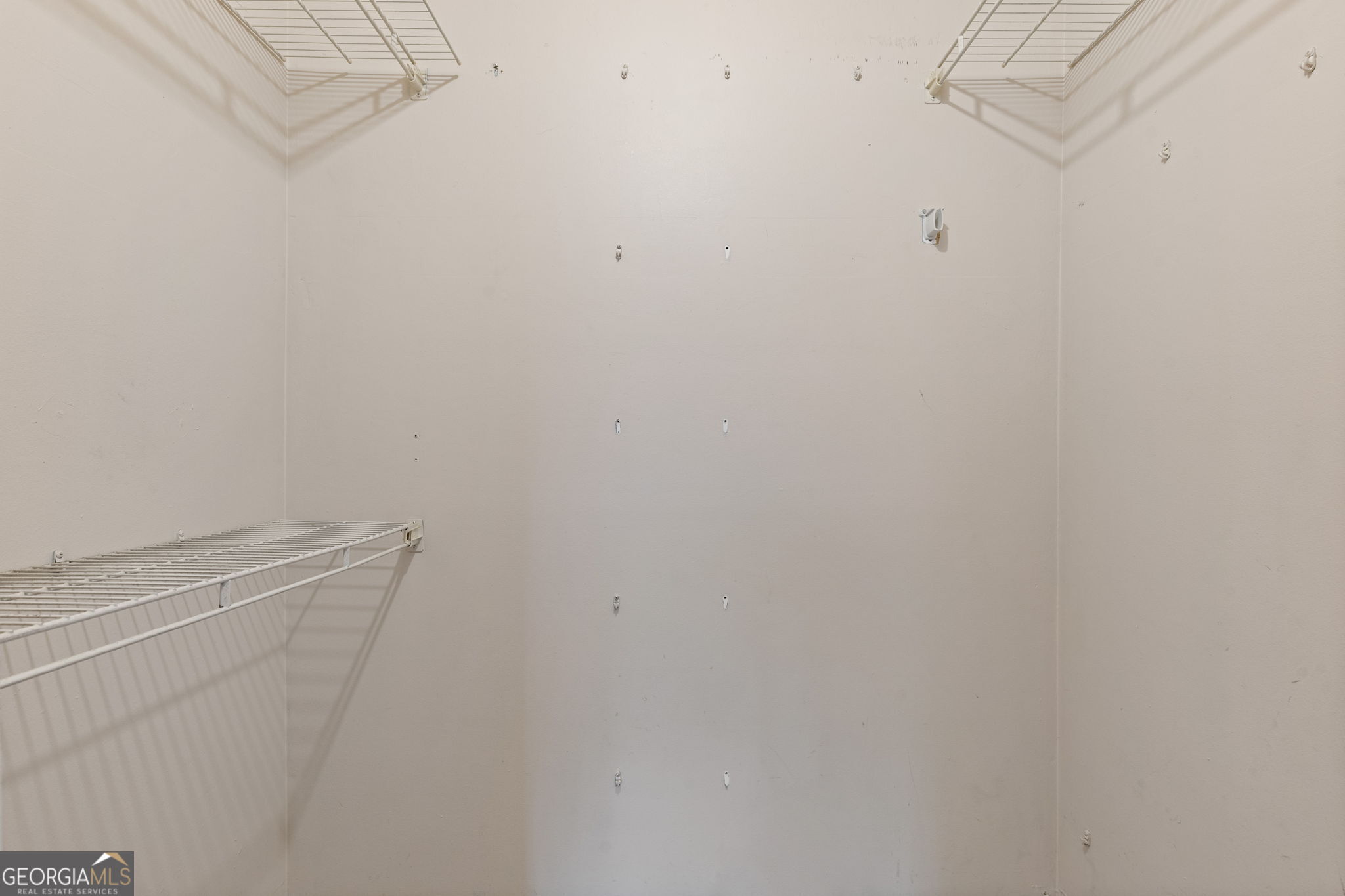 3510 Roswell Road Northwest, Unit C2 Atlanta, GA 30305 - Photo 14 of 24 a view of a room with racks on the wall