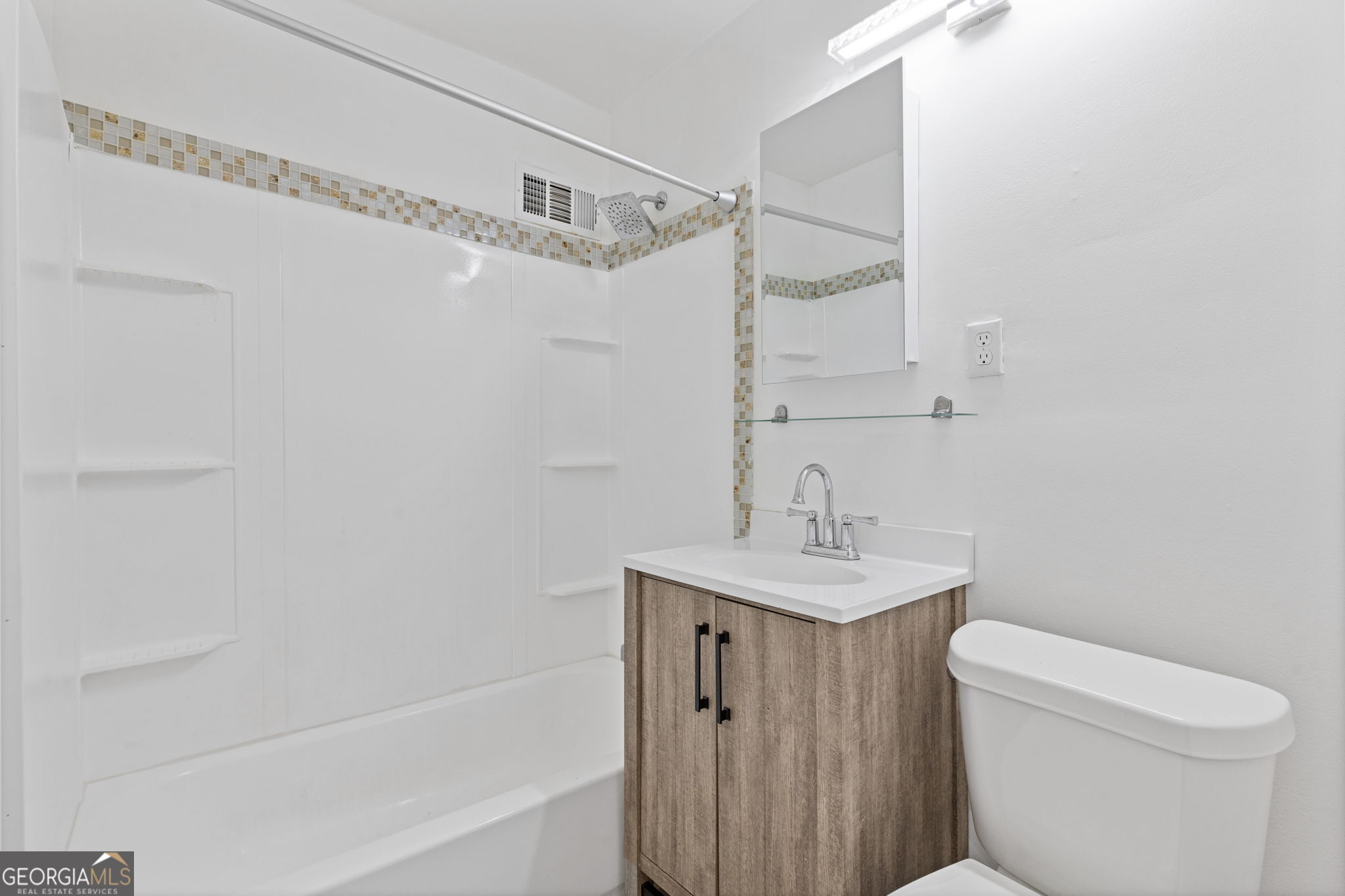 3510 Roswell Road Northwest, Unit C2 Atlanta, GA 30305 - Photo 18 of 24 a bathroom with a sink a toilet and shower