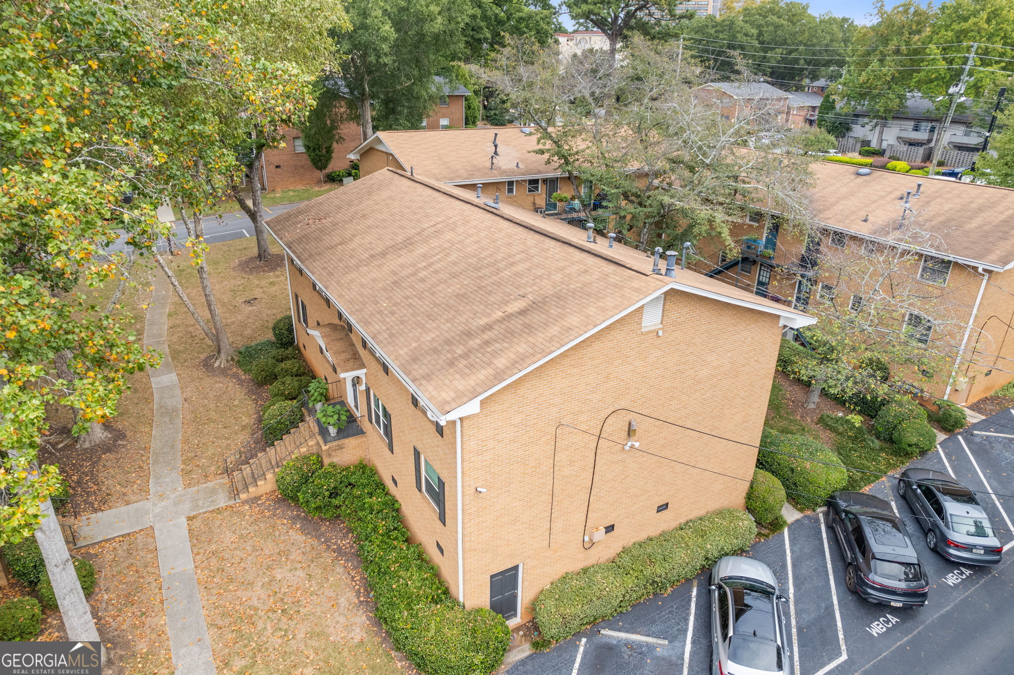 3510 Roswell Road Northwest, Unit C2 Atlanta, GA 30305 - Photo 22 of 24 an aerial view of a house with yard and patio