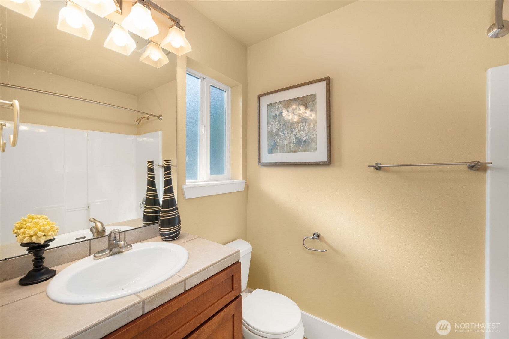 18638 92nd Avenue Northeast Bothell, WA 98011 - Photo 30 of 40 a bathroom with a sink mirror vanity and toilet