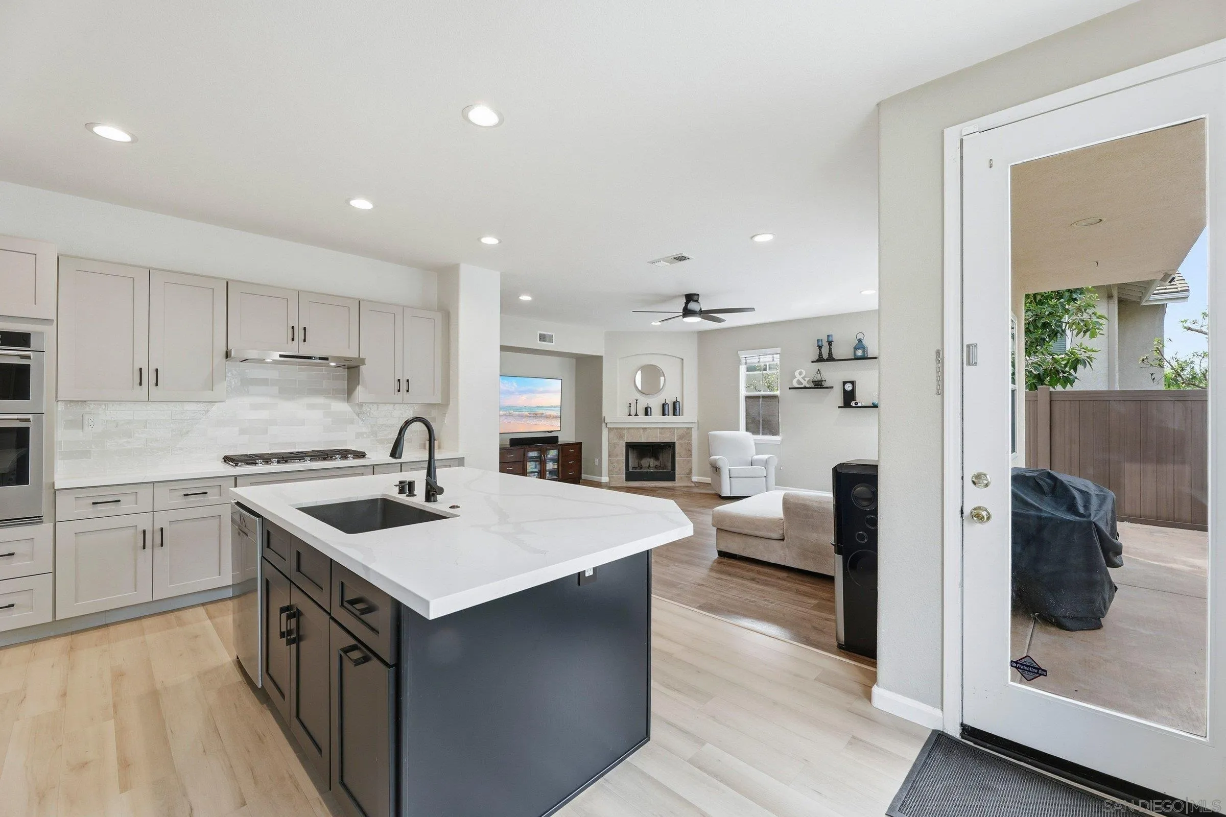 1514 West Borden Road San Marcos, CA 92069 - Photo 11 of 40 a kitchen with a sink stove and cabinets