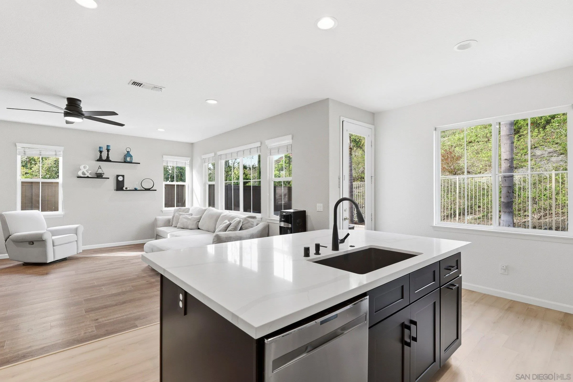 1514 West Borden Road San Marcos, CA 92069 - Photo 12 of 40 a view of kitchen island a sink and living room