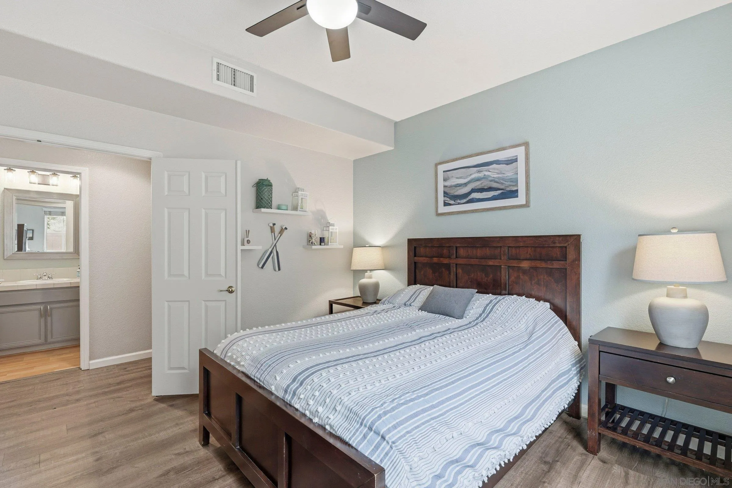 1514 West Borden Road San Marcos, CA 92069 - Photo 17 of 40 a bedroom with a bed and a lamp on table