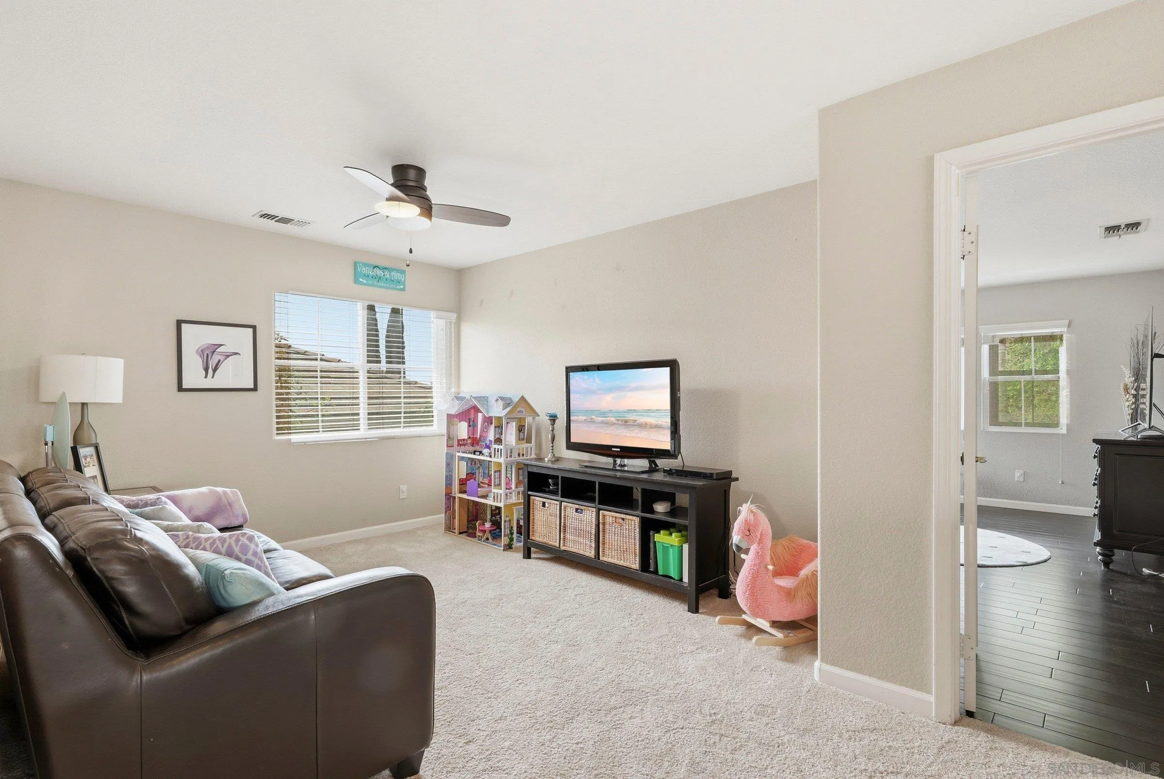 1514 West Borden Road San Marcos, CA 92069 - Photo 19 of 40 a living room with furniture and a flat screen tv