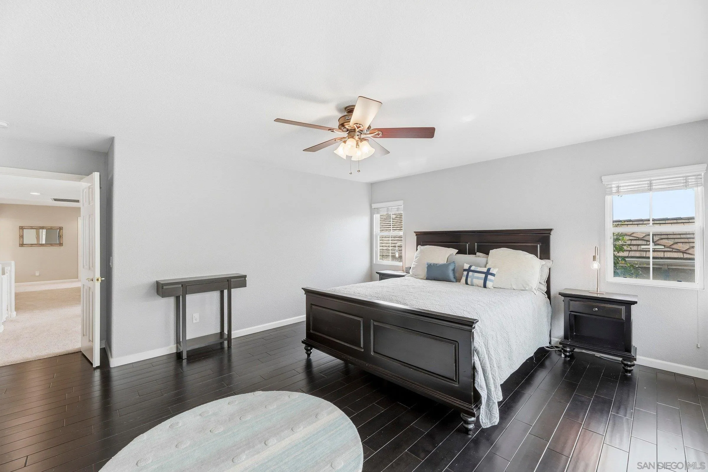 1514 West Borden Road San Marcos, CA 92069 - Photo 21 of 40 a bedroom with a bed a table and chair