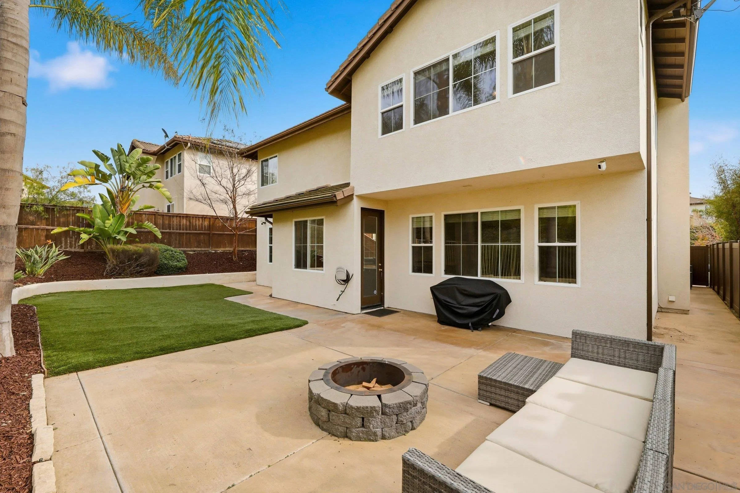 1514 West Borden Road San Marcos, CA 92069 - Photo 34 of 40 a view of a house with a backyard and a patio