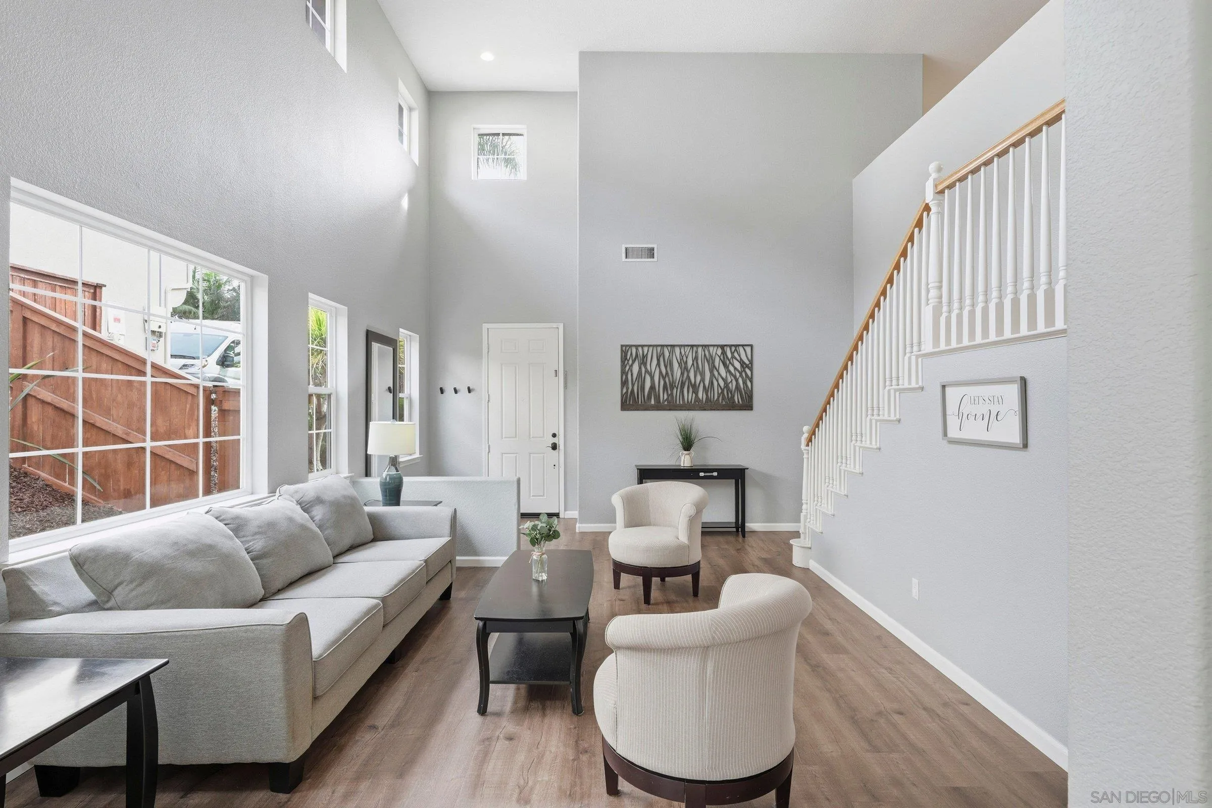 1514 West Borden Road San Marcos, CA 92069 - Photo 4 of 40 a living room with furniture and a large window