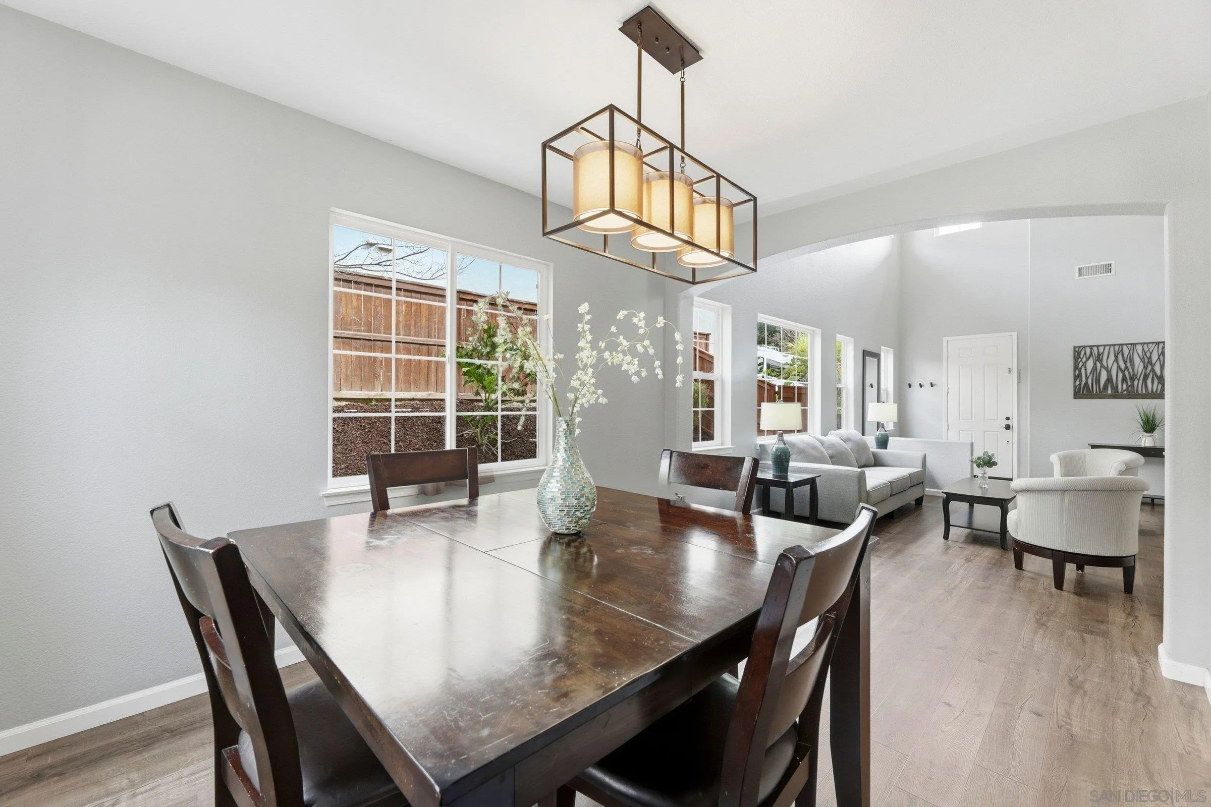 1514 West Borden Road San Marcos, CA 92069 - Photo 6 of 40 a view of a dining room with furniture window and wooden floor