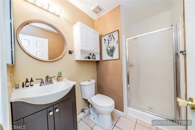 a bathroom with a toilet a sink and a mirror