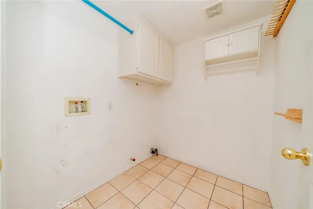 a living room with patio furniture and wooden floor
